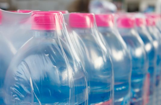 Rows of water bottles in plastic wrap