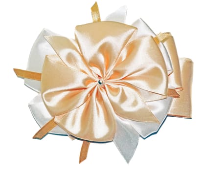 Big beautiful cream-colored bow isolated on white