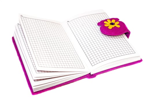 Open notebook in a purple cover on a white background                               