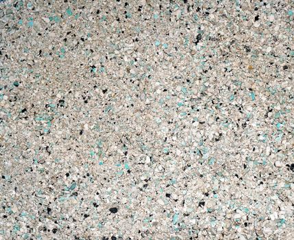 Background of small blue, gray, white and black small granules (filler cat litter)                              