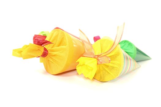 four colorful school cones on a bright background