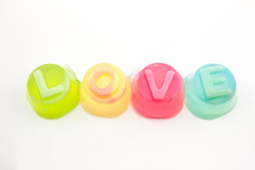 the word "love" in jelly isolated on white background