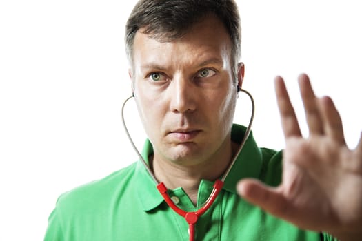 Male doctor in green shirt with red stethoscope explaining something