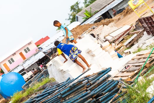 Sakaew, Thailand - May 08 , 2014 : Unidentified Children at building site ( son's worker) very dangerous area