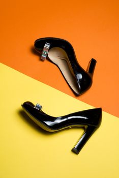 Leather woman shoes isolated on yellow background