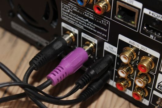 Purple and black Harman/Kardon cables