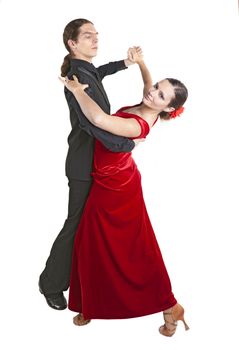 Young couple dancing waltz isolated over white background
