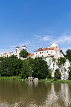 The Benedictine Abbey in Tyniec with wisla river on blue sky background