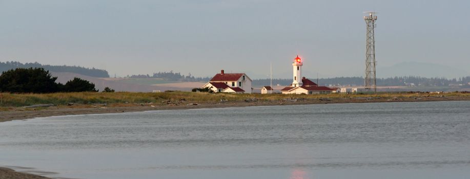 Point Wilson Lighthouse shines a guiding light into the waters of the Puget Sound