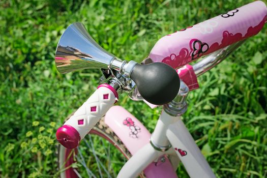 Original sound signal on a bicycle wheel for the girl in style of a retro.