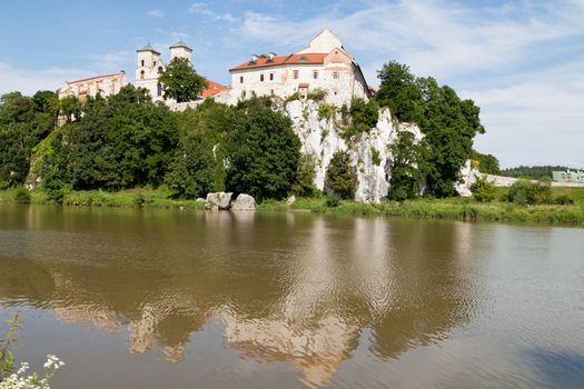 The Benedictine Abbey in Tyniec with wisla river on blue sky background