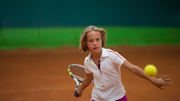 Children at school during a dribble of tennis