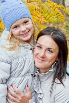 Photo of mother and daughter in autumn