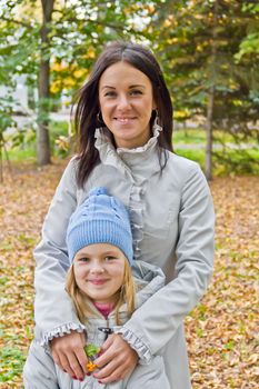 Photo of mother and daughter in autumn