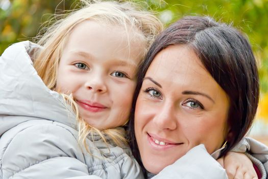 Photo of mother and daughter in autumn