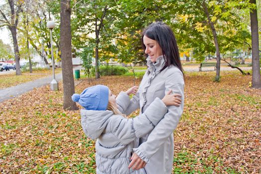 Photo of mother and daughter in autumn