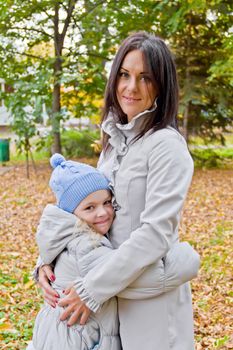 Photo of mother and daughter in autumn