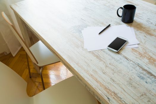 Brainstorming and taking notes at the table.