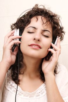 A young woman listening music with Headphones.