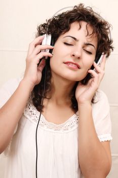 A young woman listening music with Headphones.