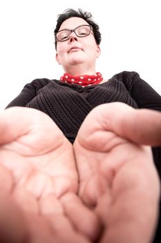 A overweight woman holding her hands open.