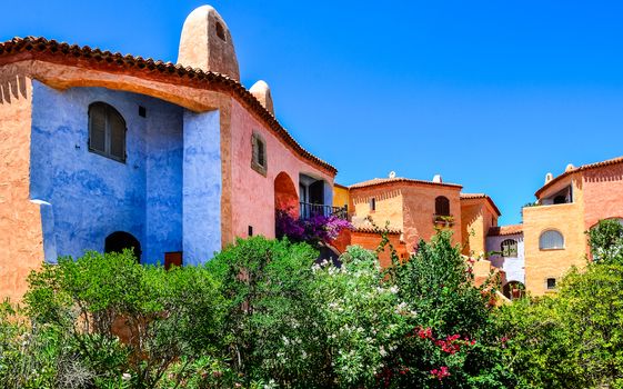 Beautiful colorful houses with nice garden, Porto Cervo, Sardinia, Italy