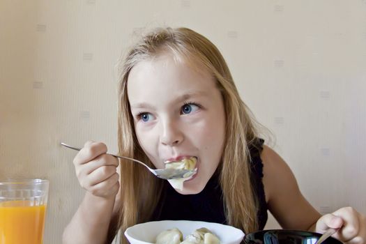 Photo of eating cute girl with blond hair