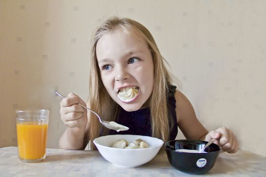 Photo of eating cute girl with blond hair