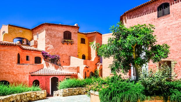 Beautiful colorful houses with nice garden, Porto Cervo, Sardinia, Italy