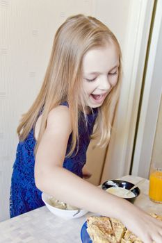 Photo of eating cute girl with blond hair