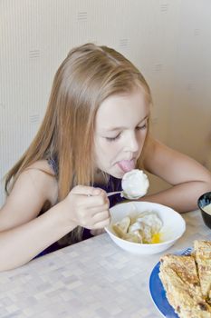 Photo of eating cute girl with blond hair