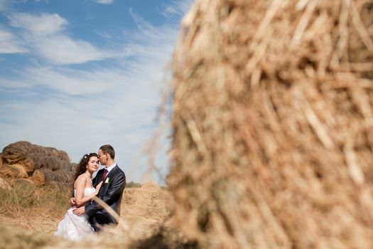 couple near the hay