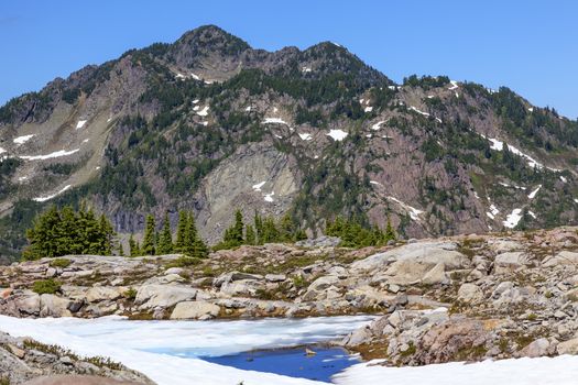 Red Mountains Small Blue Snow Pond Artist Point Mount Baker Highway in July Summertime