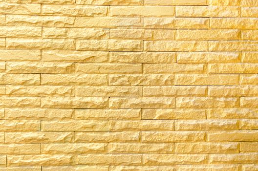 golden brick wall background pattern texture.