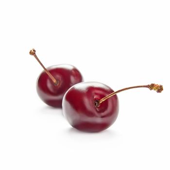 Two cherries isolate on white background