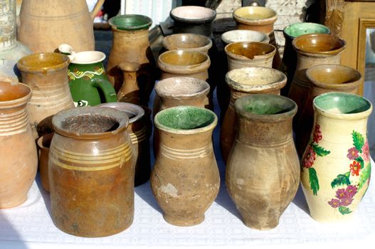Old jugs for sale at antiques fair       