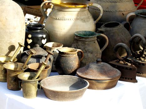 Old jugs for sale at antiques fair      