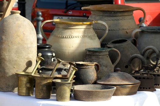 Old jugs for sale at antiques fair       