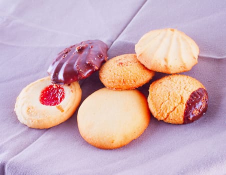 Biscuits of different kind over gray towel