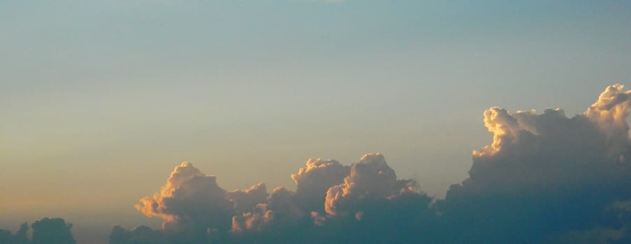 Clouds in the blue sky over the city in the evening               