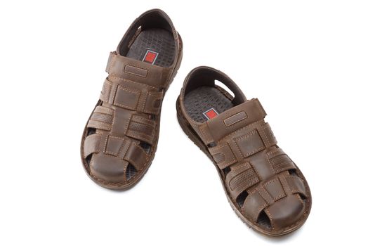 New leather sandals on a white background