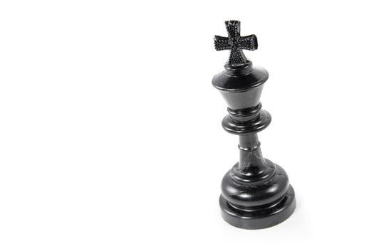 Black chess king isolated on white background