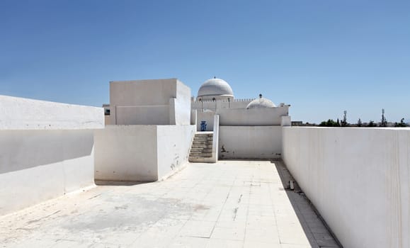 Arab mosque on a background blue sky in tunisia