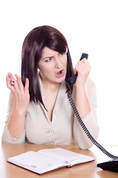 aggressive secretary shouting into phone receiver while sitting in office