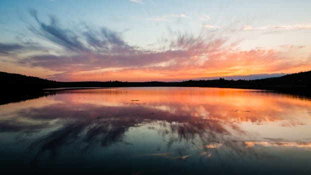 Colorful sunset reflection at lake