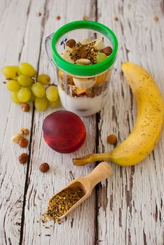 healthy organic fruit and nuts smoothie on wooden board