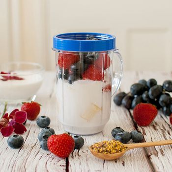 healthy organic fruit and nuts smoothie on wooden board