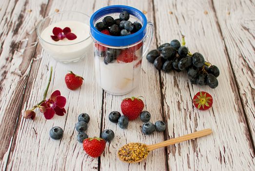 healthy organic fruit and nuts smoothie on wooden board