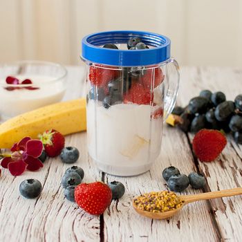 healthy organic fruit and nuts smoothie on wooden board