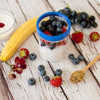 healthy organic fruit and nuts smoothie on wooden board